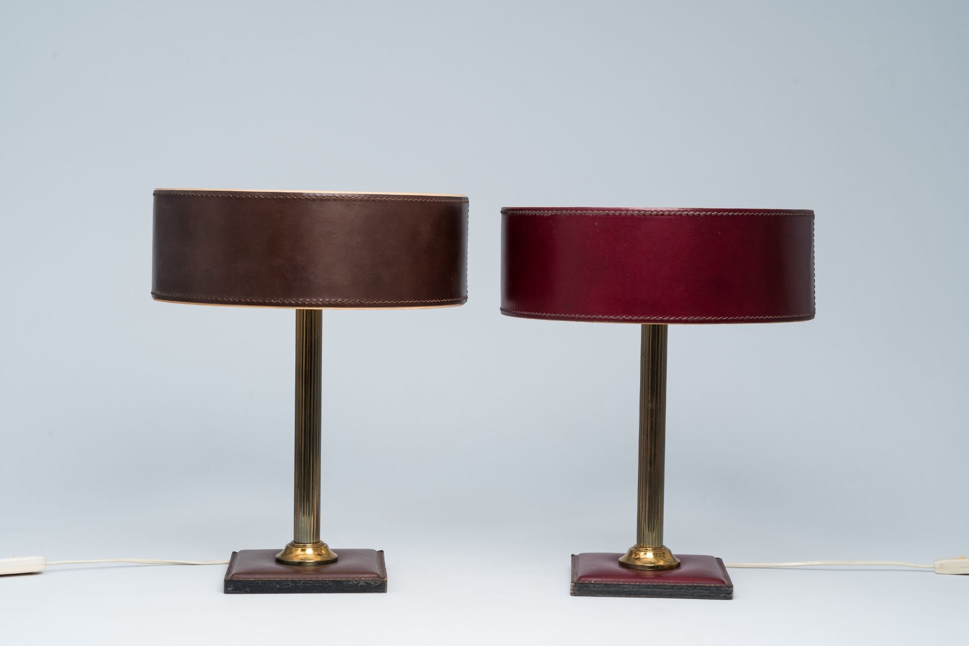 A pair of French brass and leather clad desk lamps after a design by Jacques Adnet, third quarter 20 - Image 5 of 7