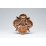 A Flemish carved oak 'Christ' roof or ceiling boss, early 16th C.
