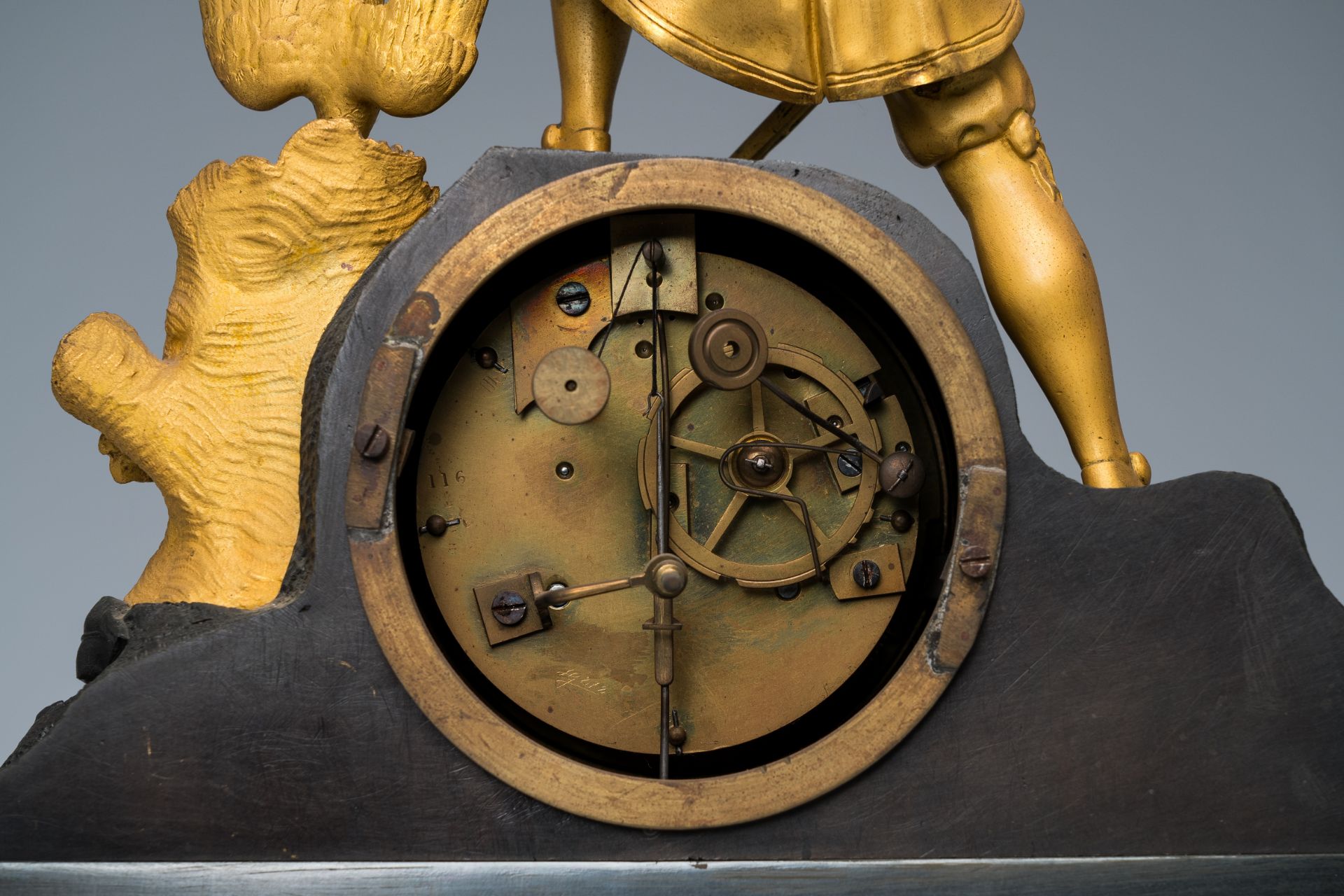 A French gilt and patinated bronze mantel clock topped with a hunter and his prey, 19th C. - Image 6 of 7