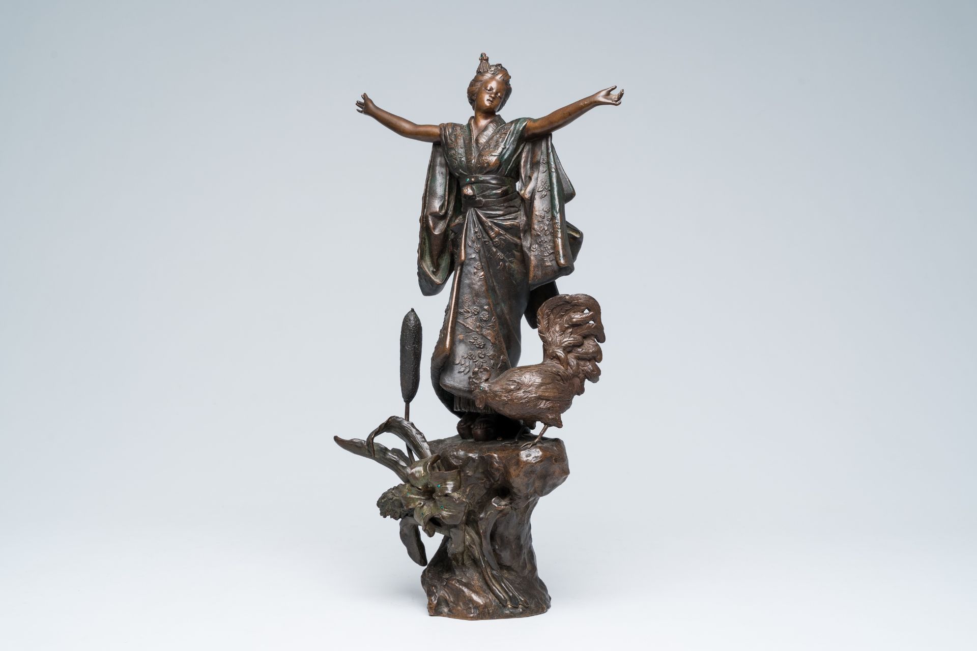A French patinated bronze sculpture of a Japanese lady with a rooster at the reed with inlay, 20th C