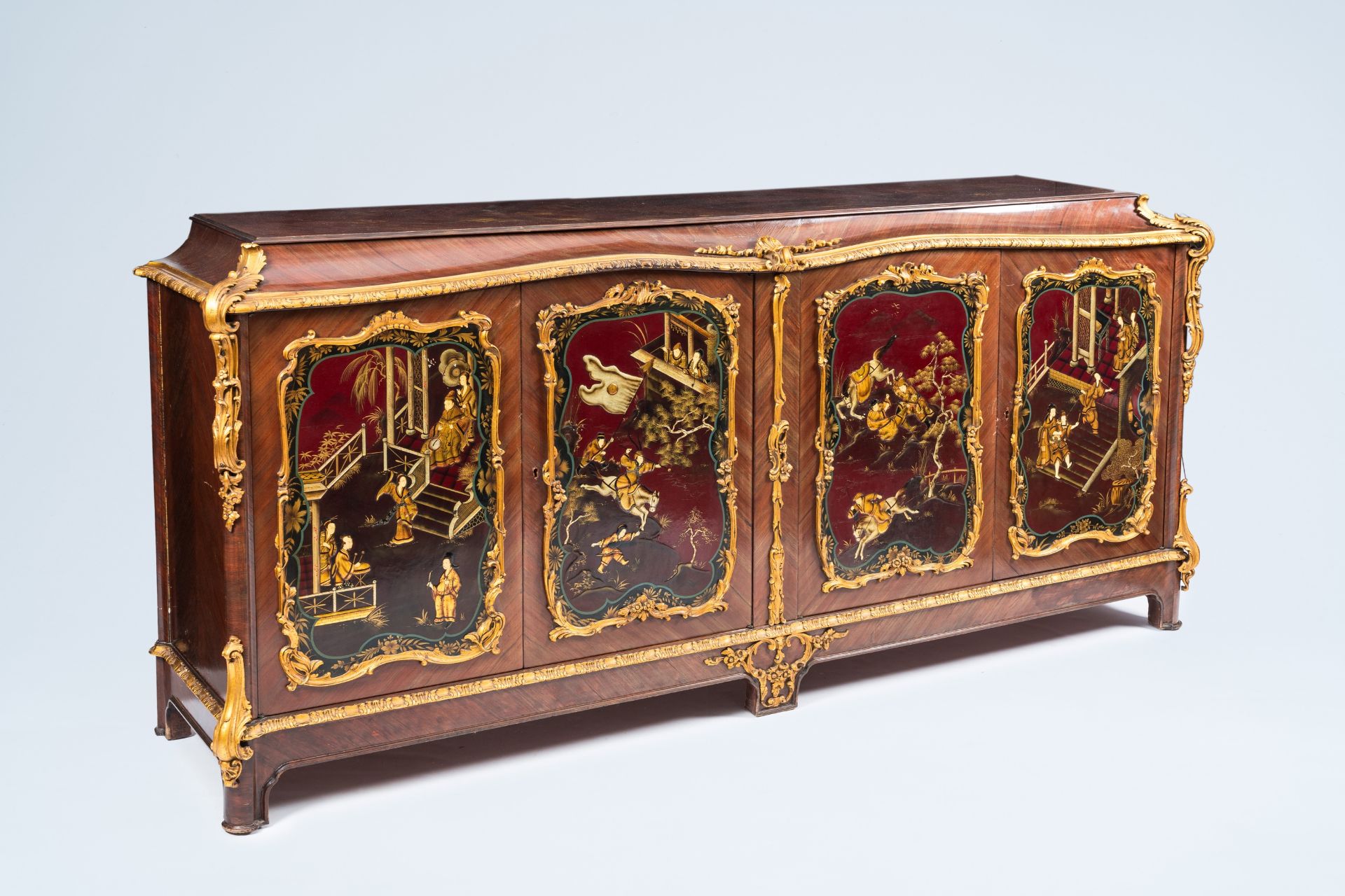 A French gilt wood and mahogany veneered four-door sideboard with oriental style lacquer, 20th C.