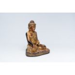 A tall inlaid gilt wood figure of a seated Buddha, Burma or Thailand, 20th C.