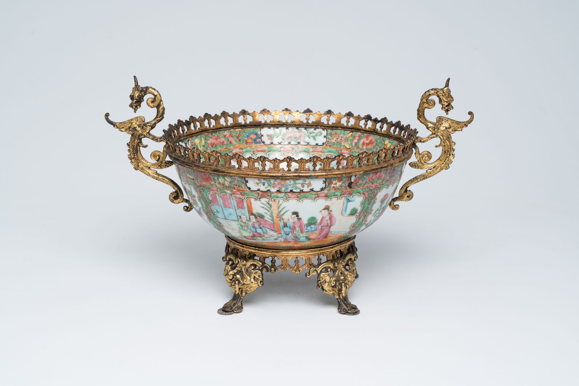 A Chinese Canton famille rose gilt mounted bowl with palace scenes, 19th C.