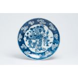 A Chinese blue and white prunus on cracked ice ground 'antiquities' charger, 19th C.