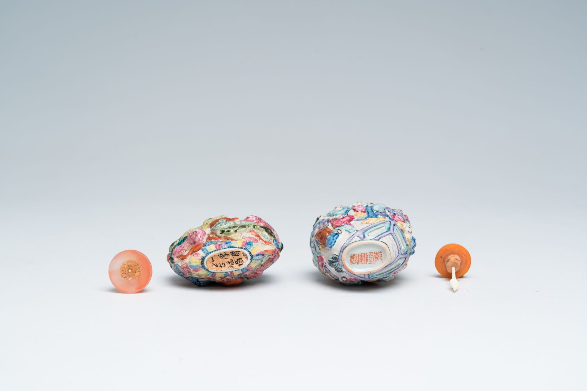 Two Chinese famille rose relief-molded snuff bottles, Qianlong mark, 19th C. - Image 6 of 6