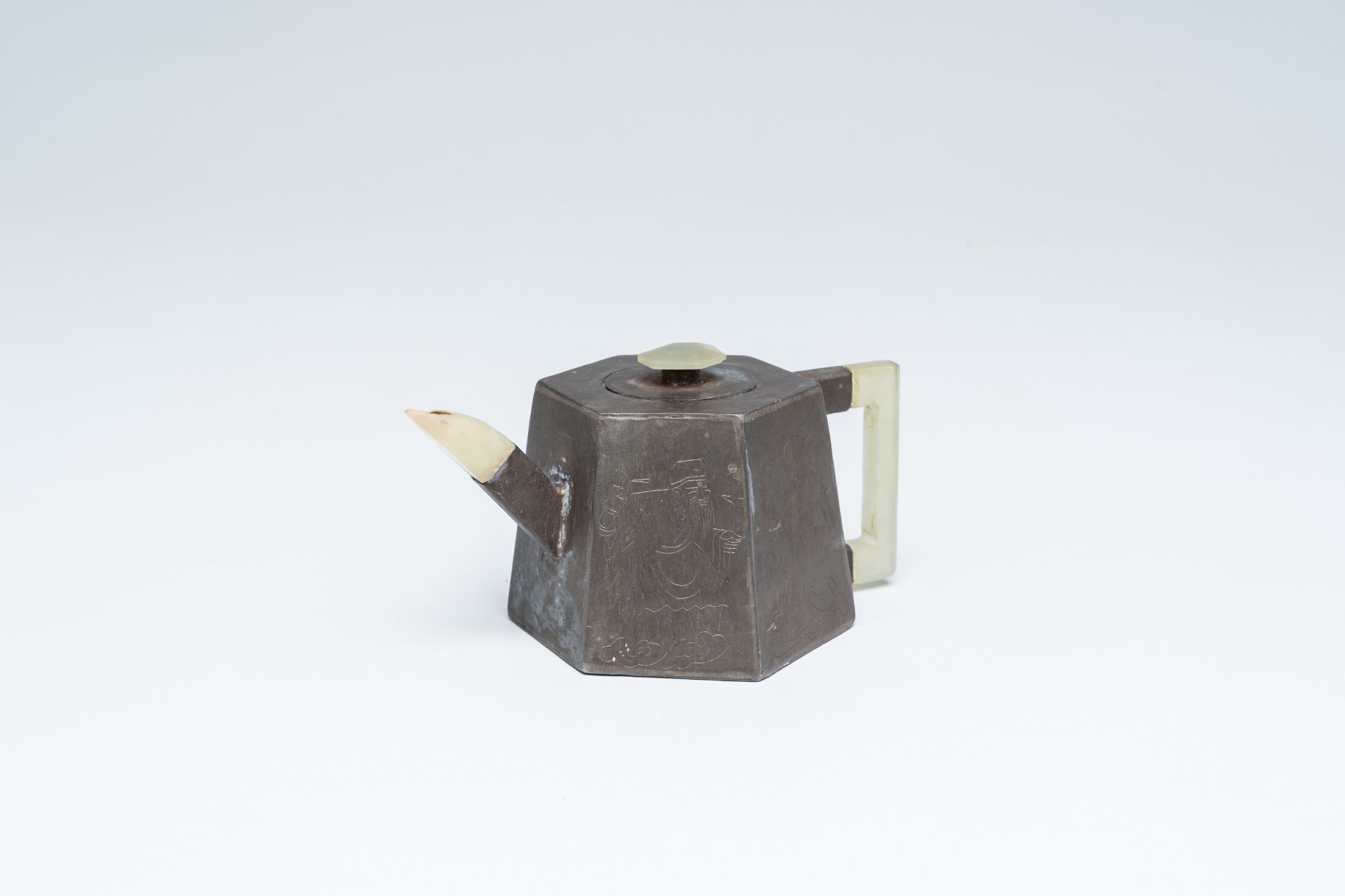 A Chinese inscribed pewter encased Yixing stoneware teapot with jade mounts, 19th C.