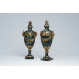 A pair of Neoclassical vert de mer marble cassolettes mounted with rams' heads and floral garlands,