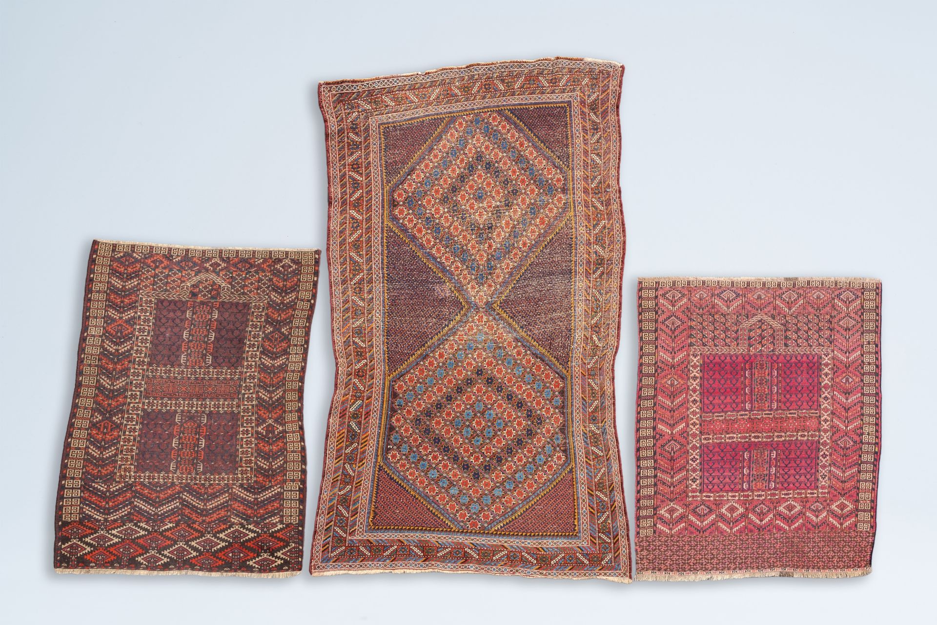 Two Turkmen prayer rugs with stylized motifs and a Persian Khamseh rug, wool on cotton, first half 2 - Image 2 of 5