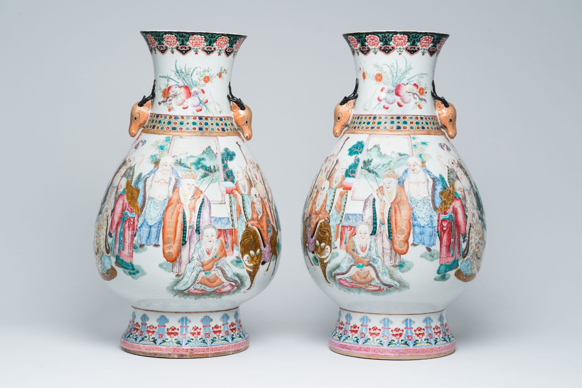 A pair of impressive Chinese famille rose 'hu' vases with the Eighteen Arhats or Luohans in a landsc