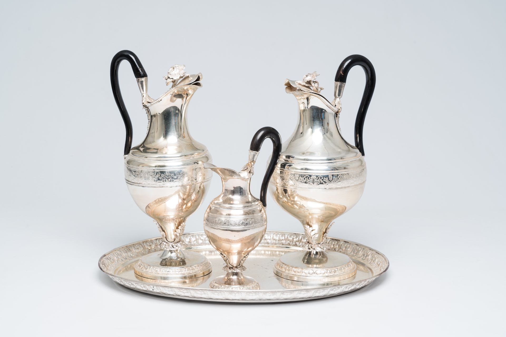 A four-piece French-Belgian silver coffee set with floral relief design, 19th/20th C.