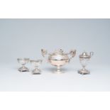 A French Neoclassical silver sugar bowl with floral relief design, maker's mark I.M., two salts and