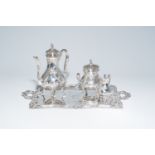 A four-piece French rococo revival silver coffee set with floral design and a monogram, maker's mark