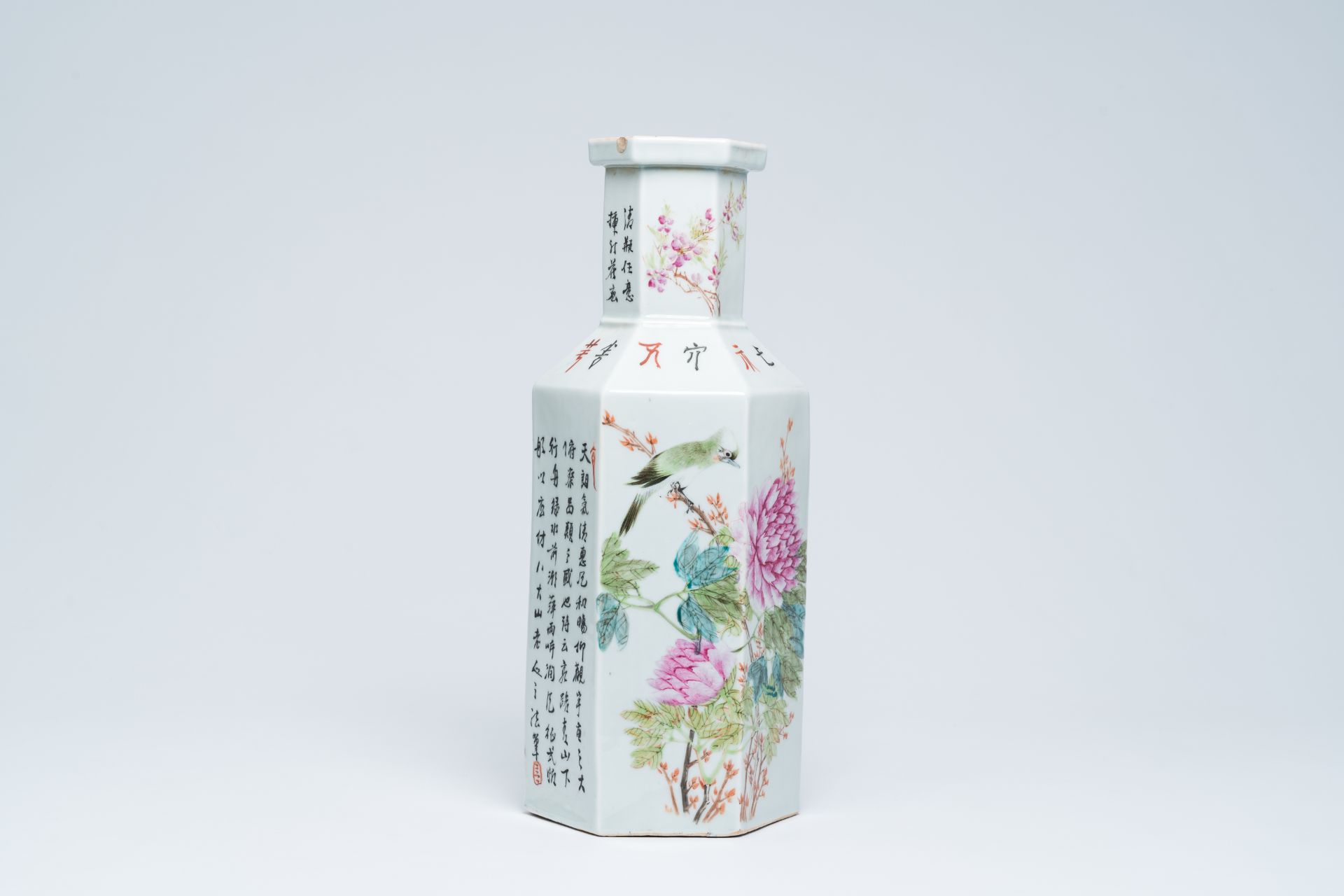A hexagonal Chinese qianjiang cai vase with an animated landscape and a bird on a blossoming branch,