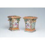 A pair of Chinese Canton famille rose flower holders with palace scenes and birds among blossoming b
