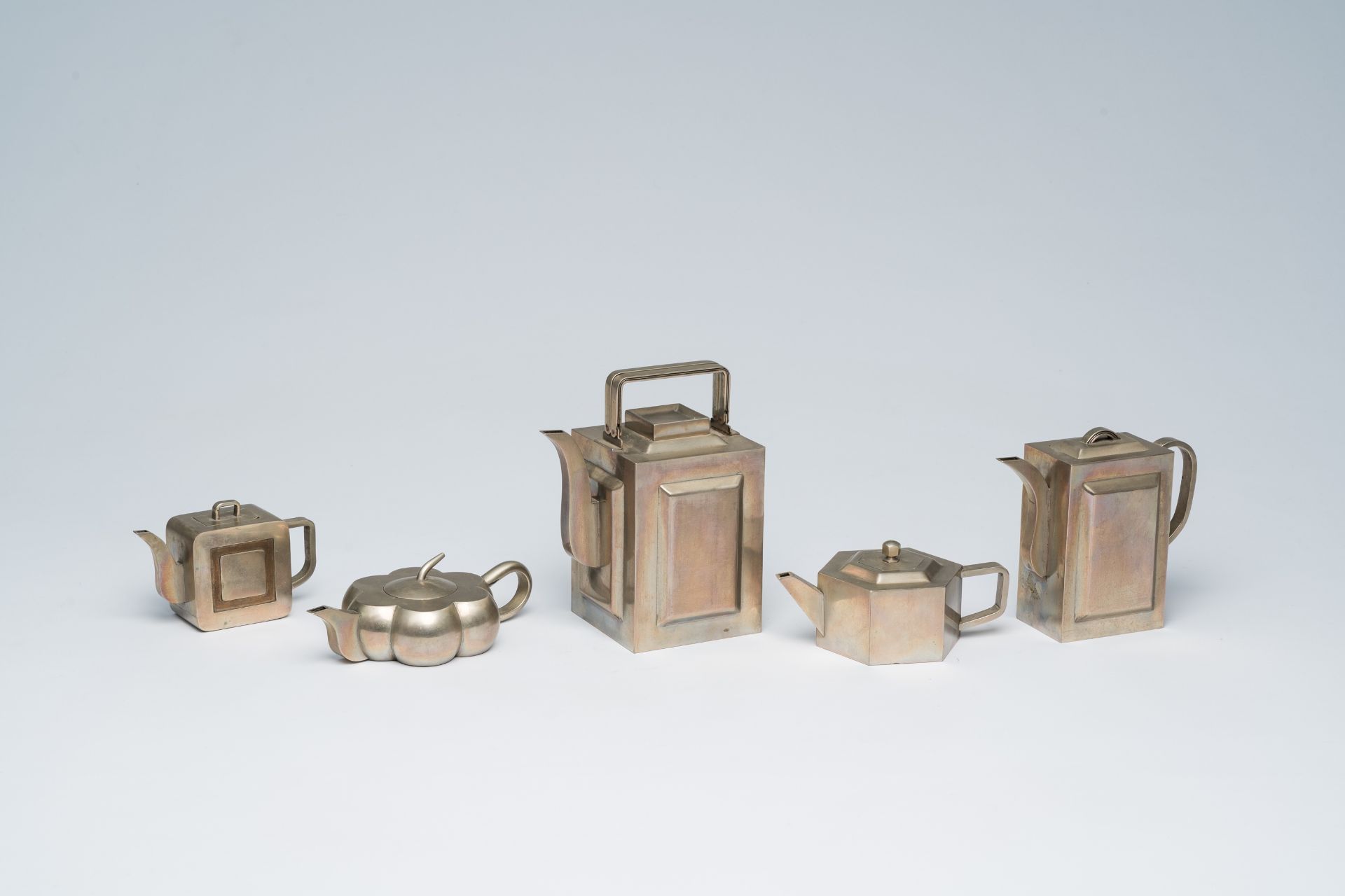 Five various Chinese paktong teapots and covers, 19th/20th C.