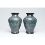A pair of Japanese champleve vases with phoenixes and figures among blossoming branches, Meiji, 19th
