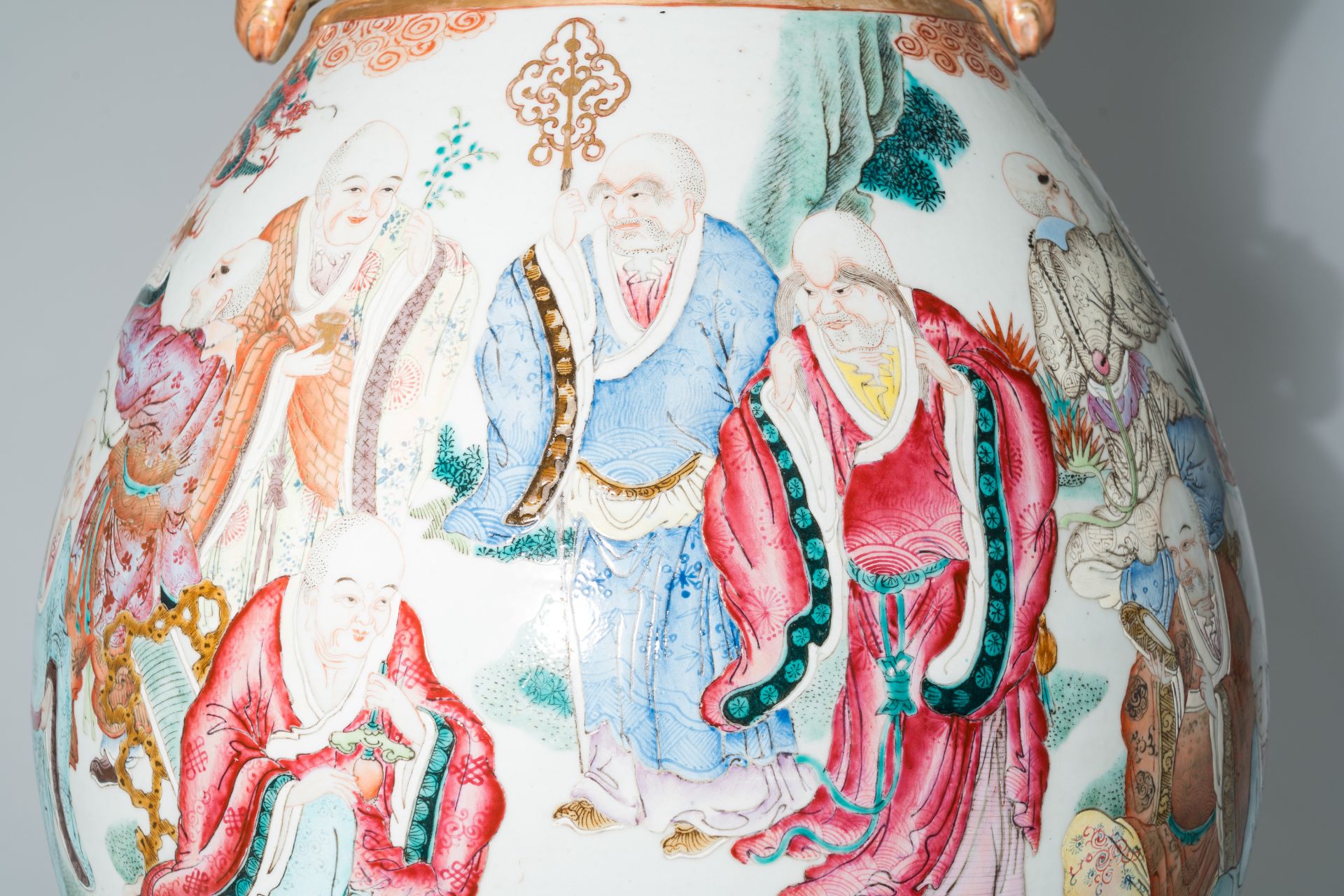 A pair of impressive Chinese famille rose 'hu' vases with the Eighteen Arhats or Luohans in a landsc - Image 9 of 13