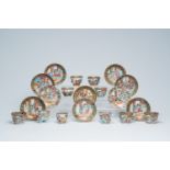 Ten Chinese Canton famille rose cups and saucers with palace scenes and figures in a landscape, 19th