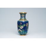 A Chinese cloisonne vase with floral design all around, 19th/20th C.