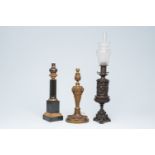 Two French gilt and patinated bronze relief decorated lamps and a Neoclassical lamp with flutes, 19t