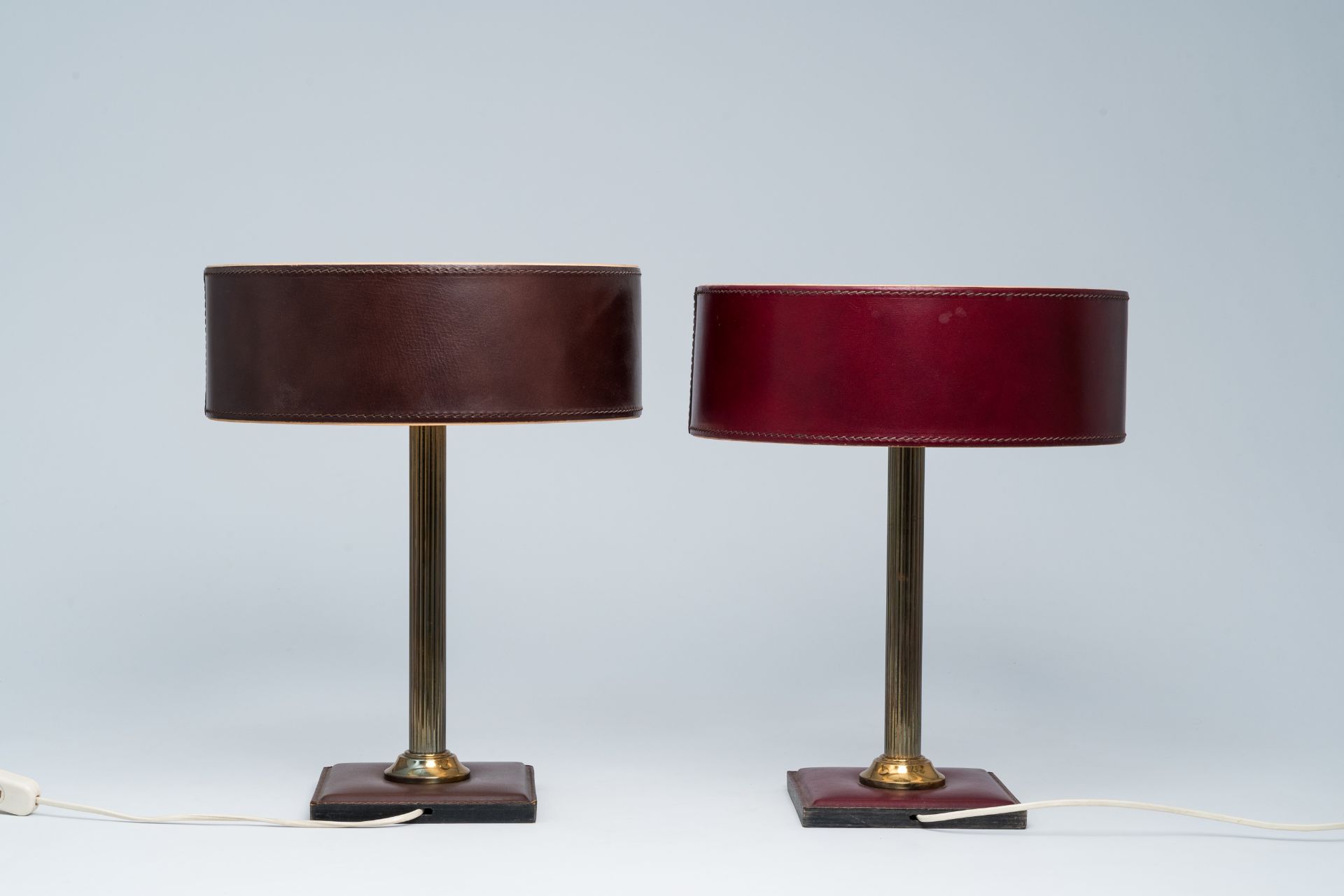 A pair of French brass and leather clad desk lamps after a design by Jacques Adnet, third quarter 20 - Image 3 of 7