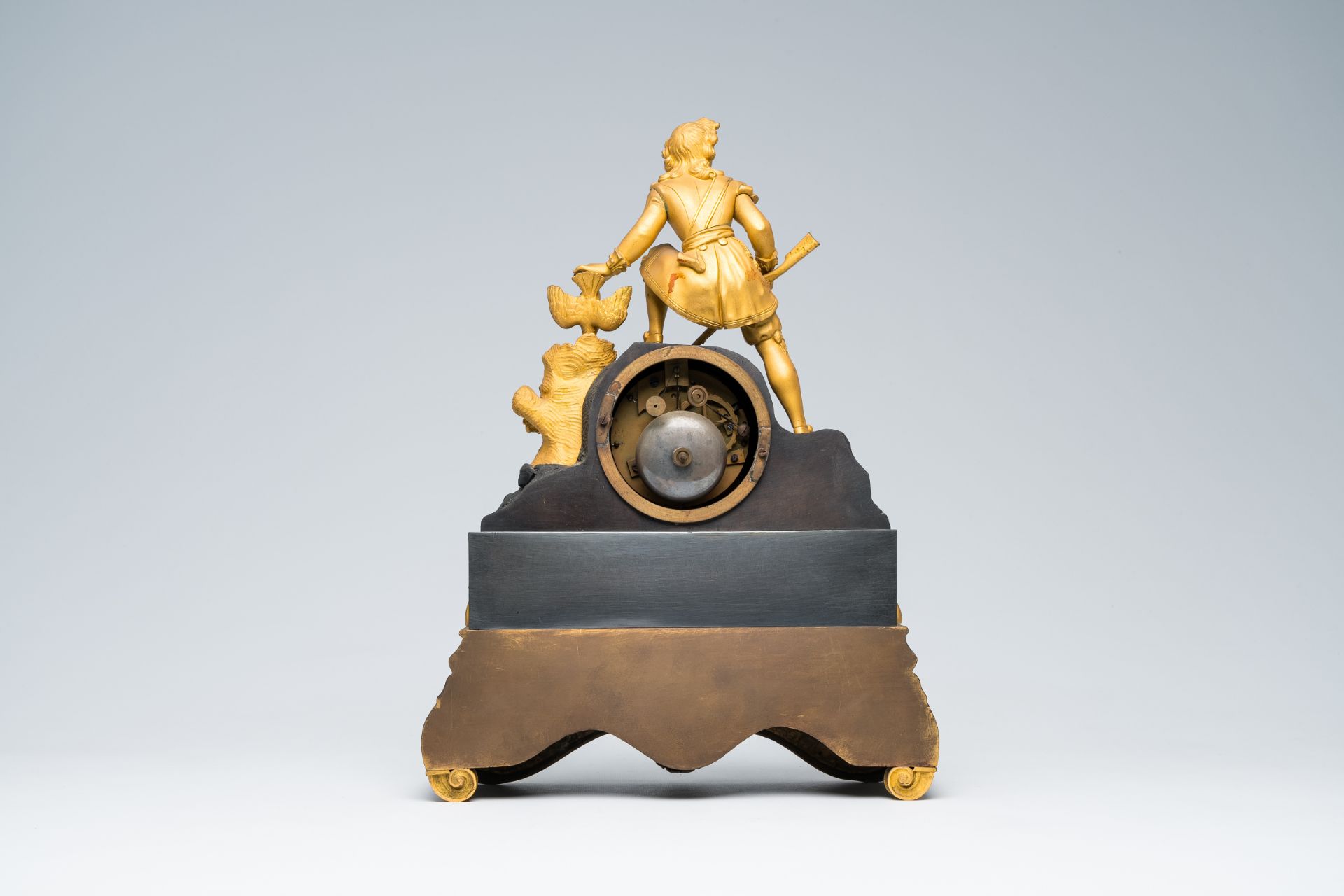 A French gilt and patinated bronze mantel clock topped with a hunter and his prey, 19th C. - Image 4 of 7