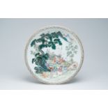 A large Chinese famille rose charger with playing children and goats in a mountainous landscape, Qia