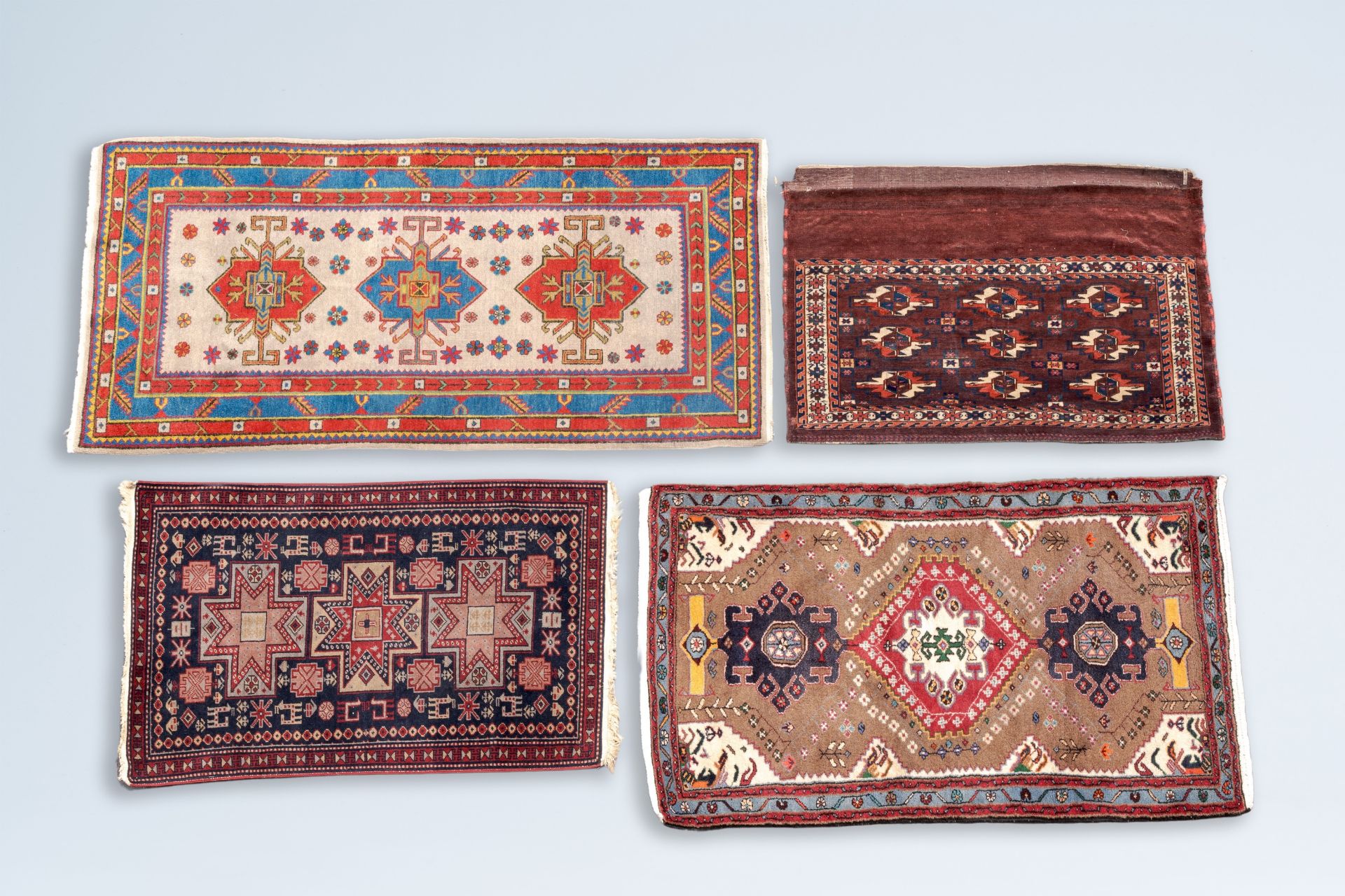 Four various Oriental rugs with geometric design, a.o. a Persian Taleghan rug, wool on cotton, 20th