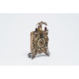 A gilt silver Baroque revival Viennese table clock crowned with an eagle and inlaid with turquoise,