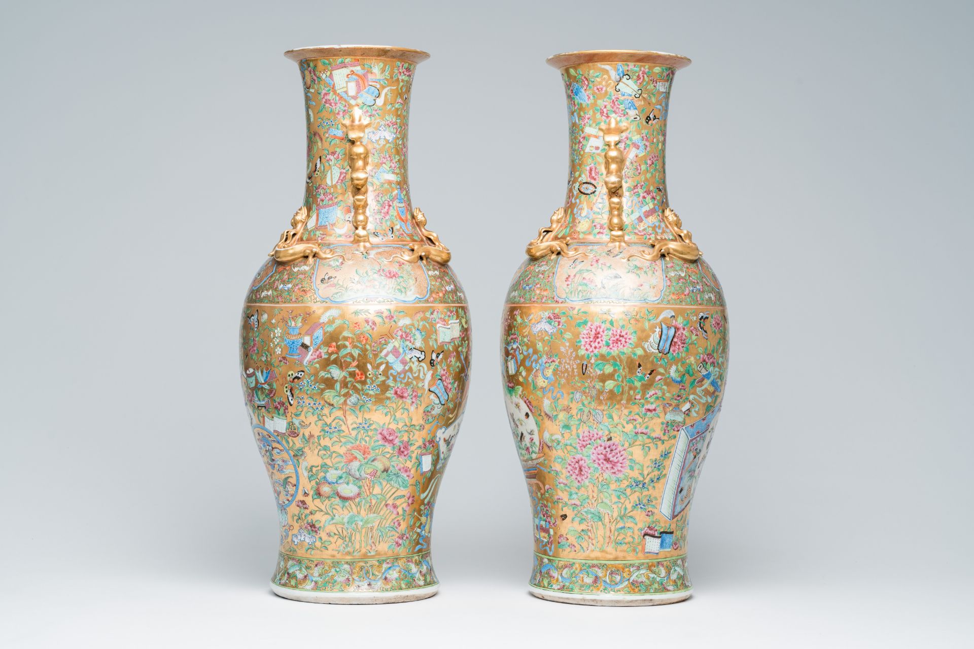 A pair of Chinese Canton famille rose gold ground vases with birds and butterflies among blossoming - Image 2 of 6