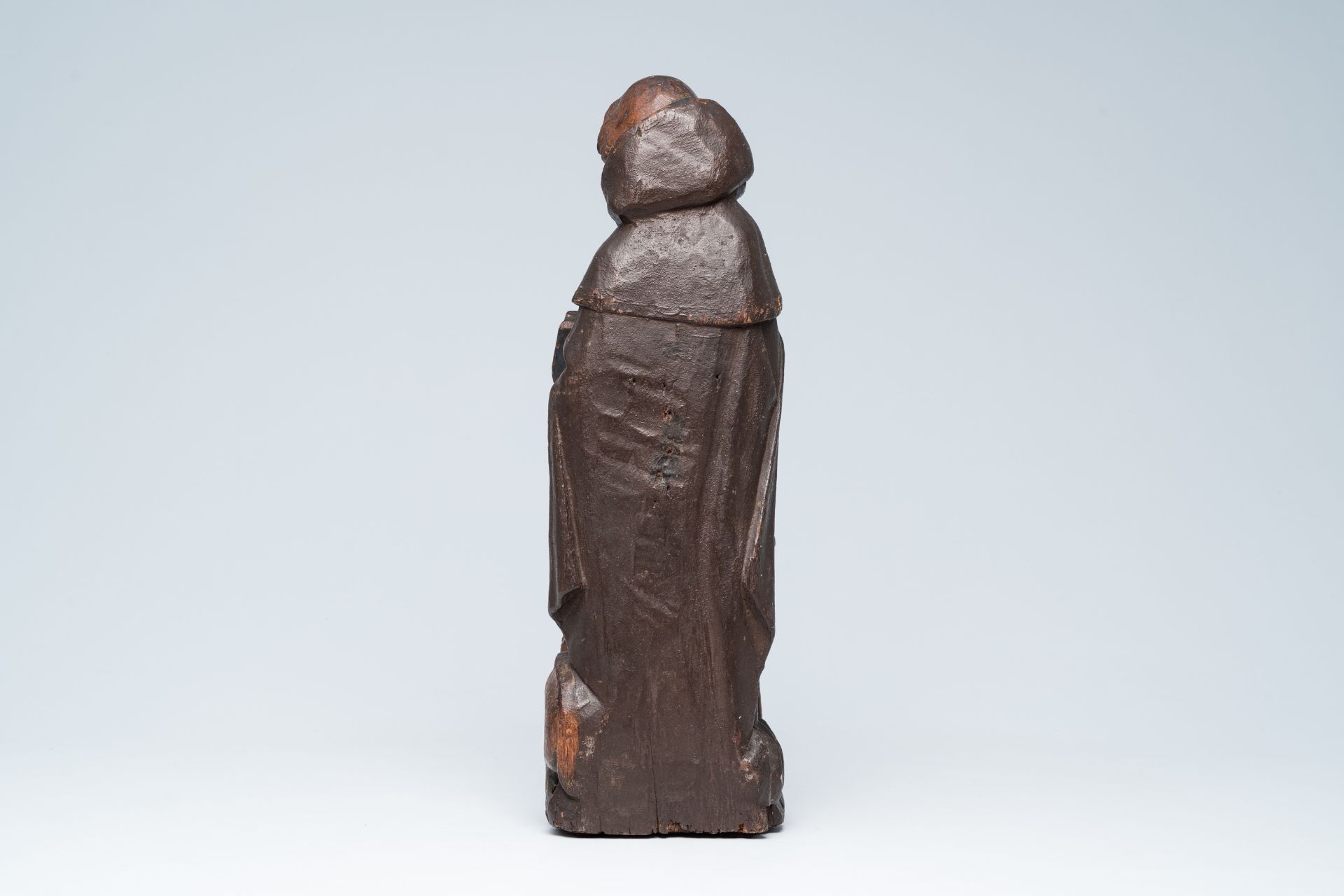 A Flemish carved oak figure of Saint Anthony the Great with traces of polychromy, 15th/16th C. - Image 3 of 6