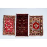 Three various Oriental rugs with geometric and floral design, wool on cotton, 20th C.