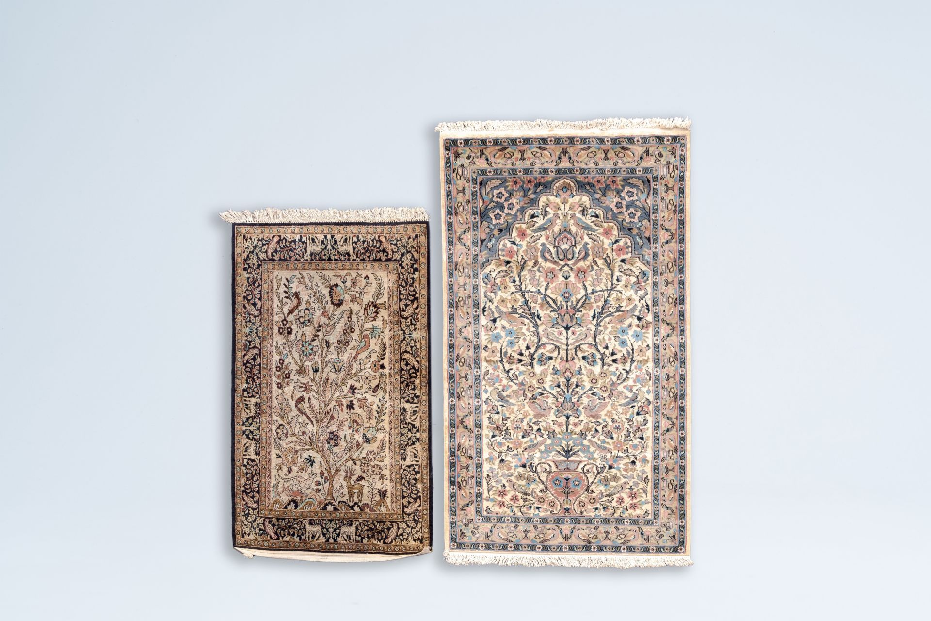 Two Persian Goum and Isfahan 'Tree of Life' rugs, wool and silk on cotton, Iran, 20th C.