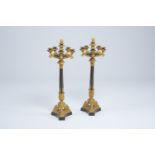 A pair of French gilt and patinated bronze five-light candelabra with floral design, 19th C.