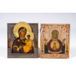 Two orthodox icons, 'Our Lady of the Sign' and 'The Mother of God of Smolensk' with gilt and silver