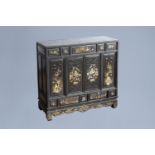A Vietnamese mother-of-pearl inlaid wood two-door cabinet with figures in a palace garden and floral