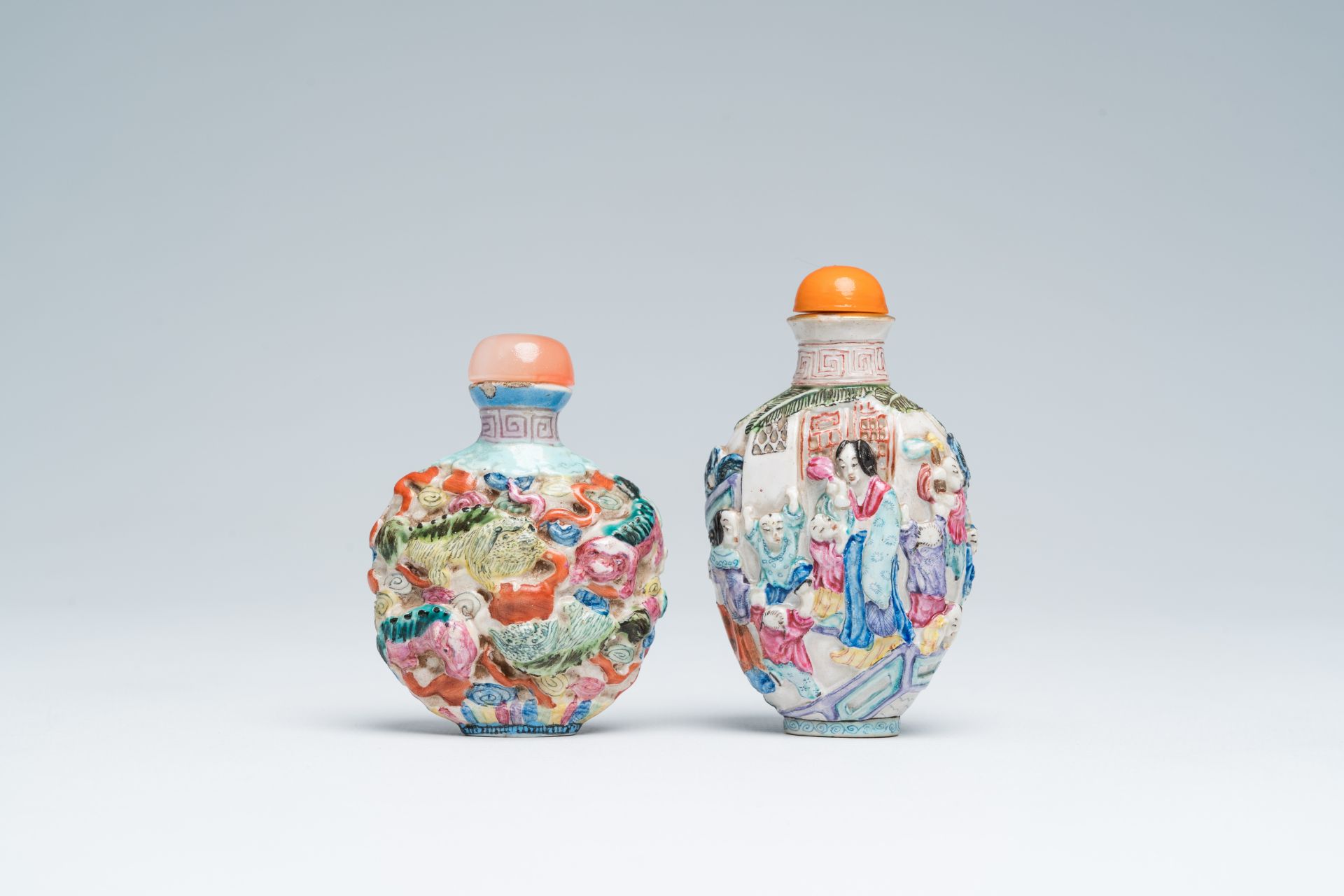 Two Chinese famille rose relief-molded snuff bottles, Qianlong mark, 19th C. - Image 3 of 6