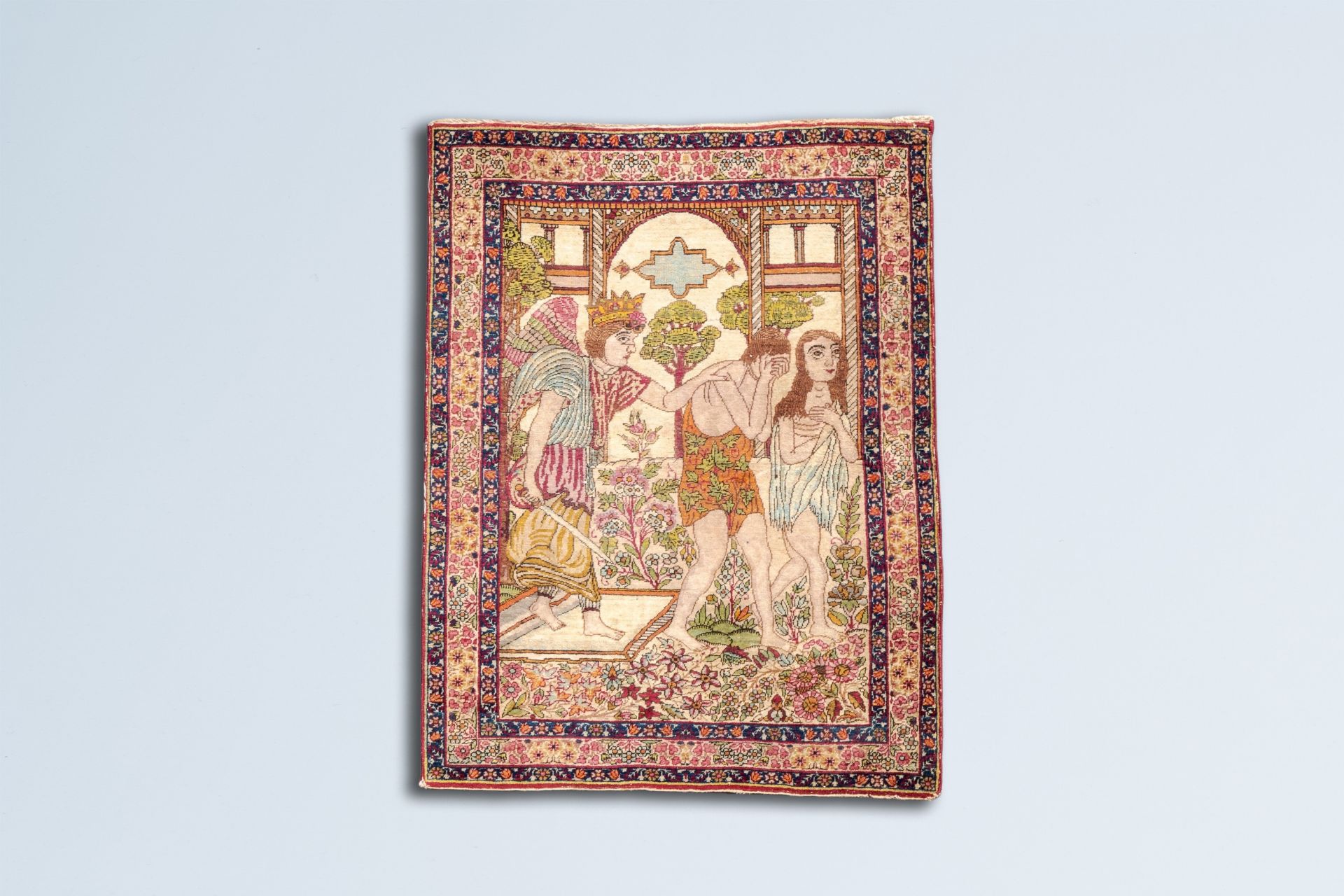 A Persian Kerman carpet depicting the expulsion of Adam and Eve from the earthly paradise, wool on c