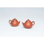 Two Chinese Yixing stoneware teapots and covers, 19th C.