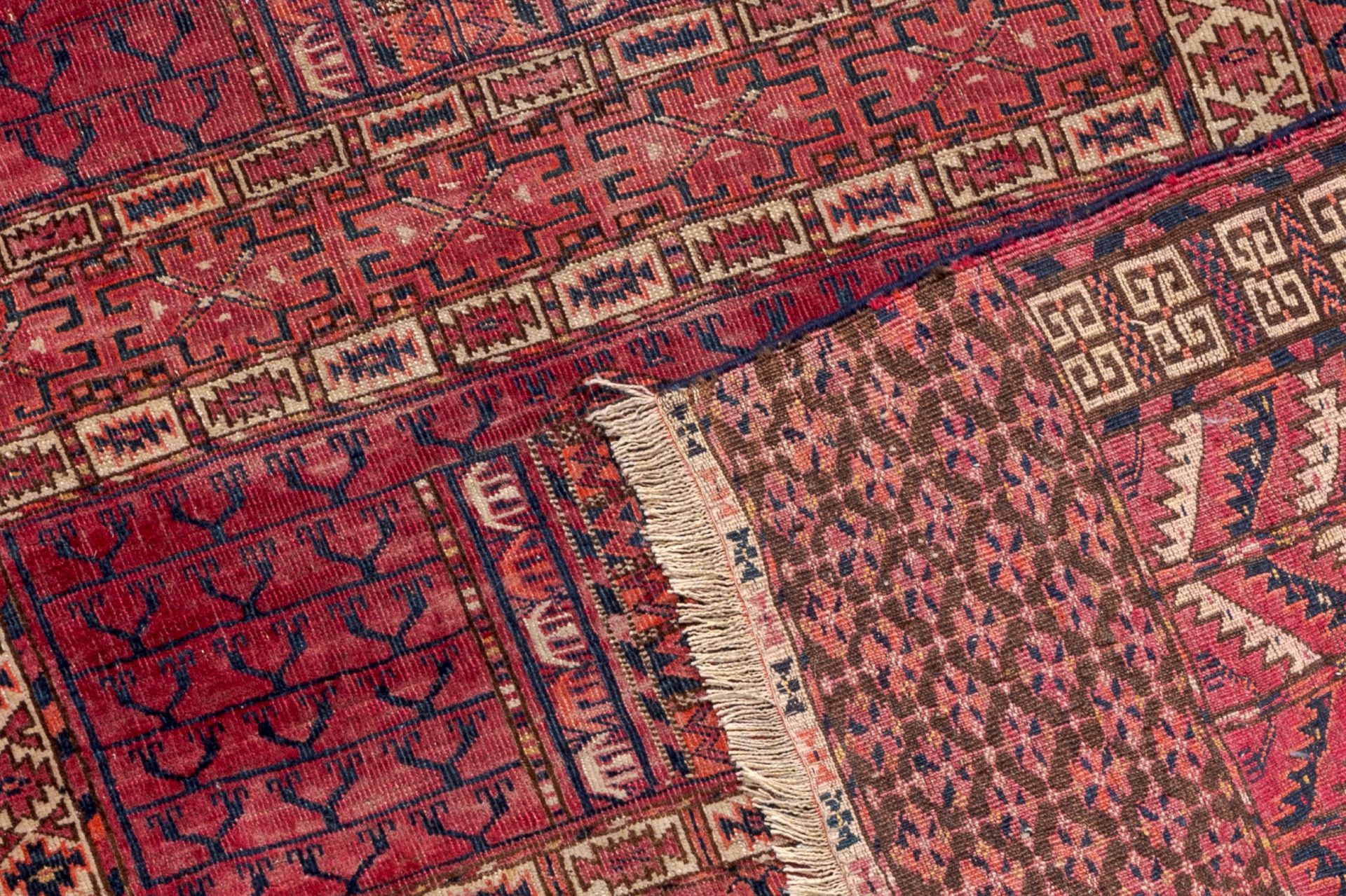 Two Turkmen prayer rugs with stylized motifs and a Persian Khamseh rug, wool on cotton, first half 2 - Image 5 of 5