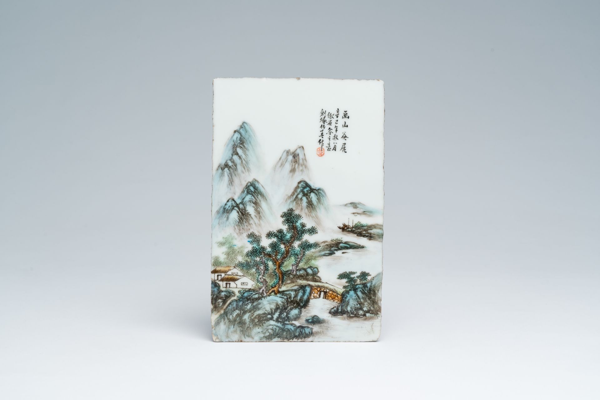 A Chinese qianjiang cai plaque with a mountainous river landscape, 20th C.