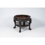 A Chinese richly carved hardwood table, 19th C.
