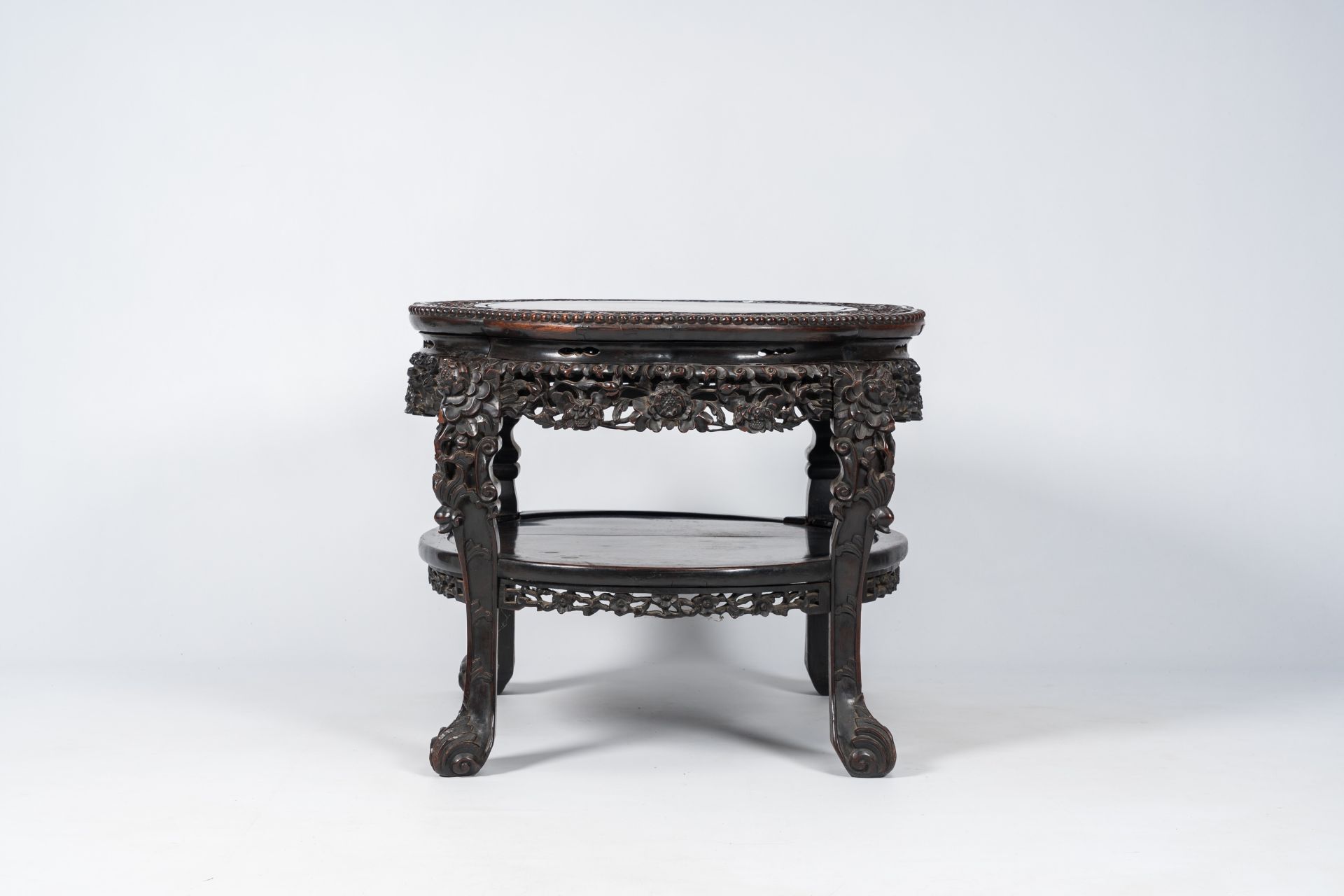 A Chinese richly carved hardwood table, 19th C. - Image 2 of 7