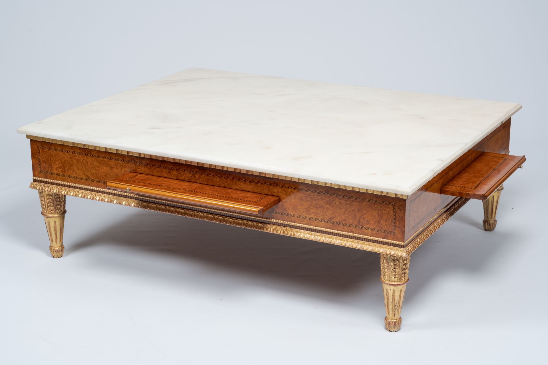 A Neoclassical partly gilt wood coffee table with marble top and four extendable plateaus, 20th C. - Image 2 of 8