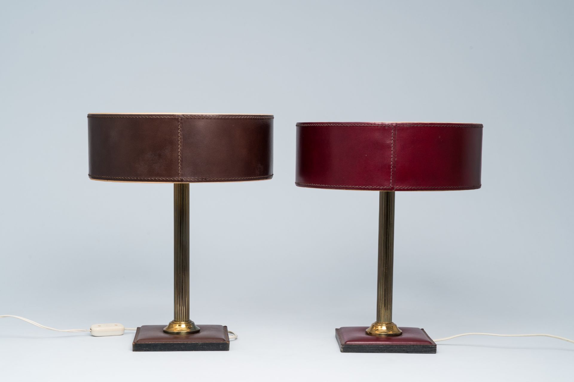A pair of French brass and leather clad desk lamps after a design by Jacques Adnet, third quarter 20 - Image 2 of 7