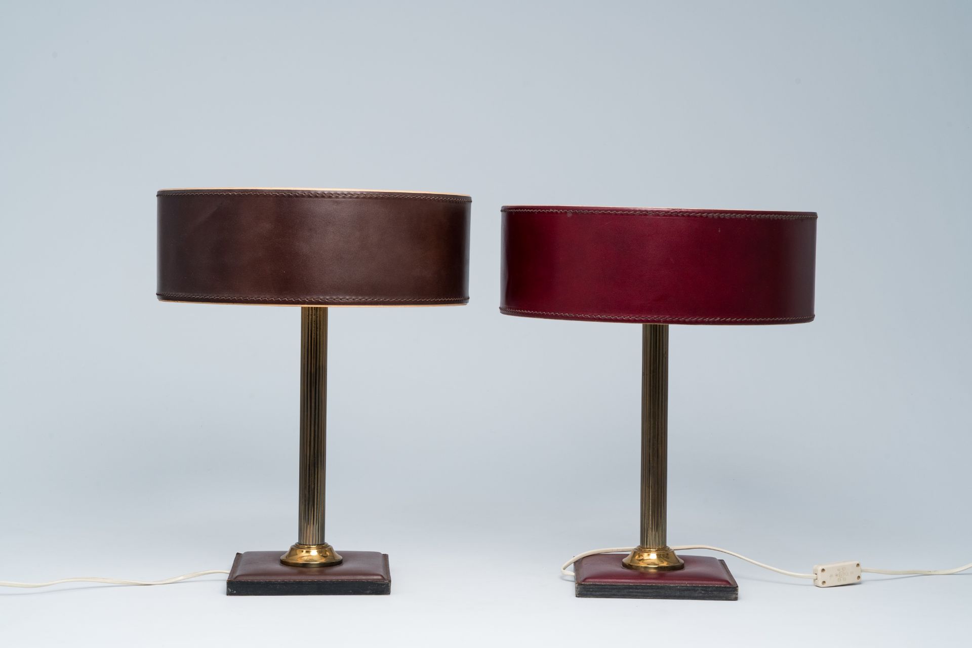 A pair of French brass and leather clad desk lamps after a design by Jacques Adnet, third quarter 20 - Image 4 of 7