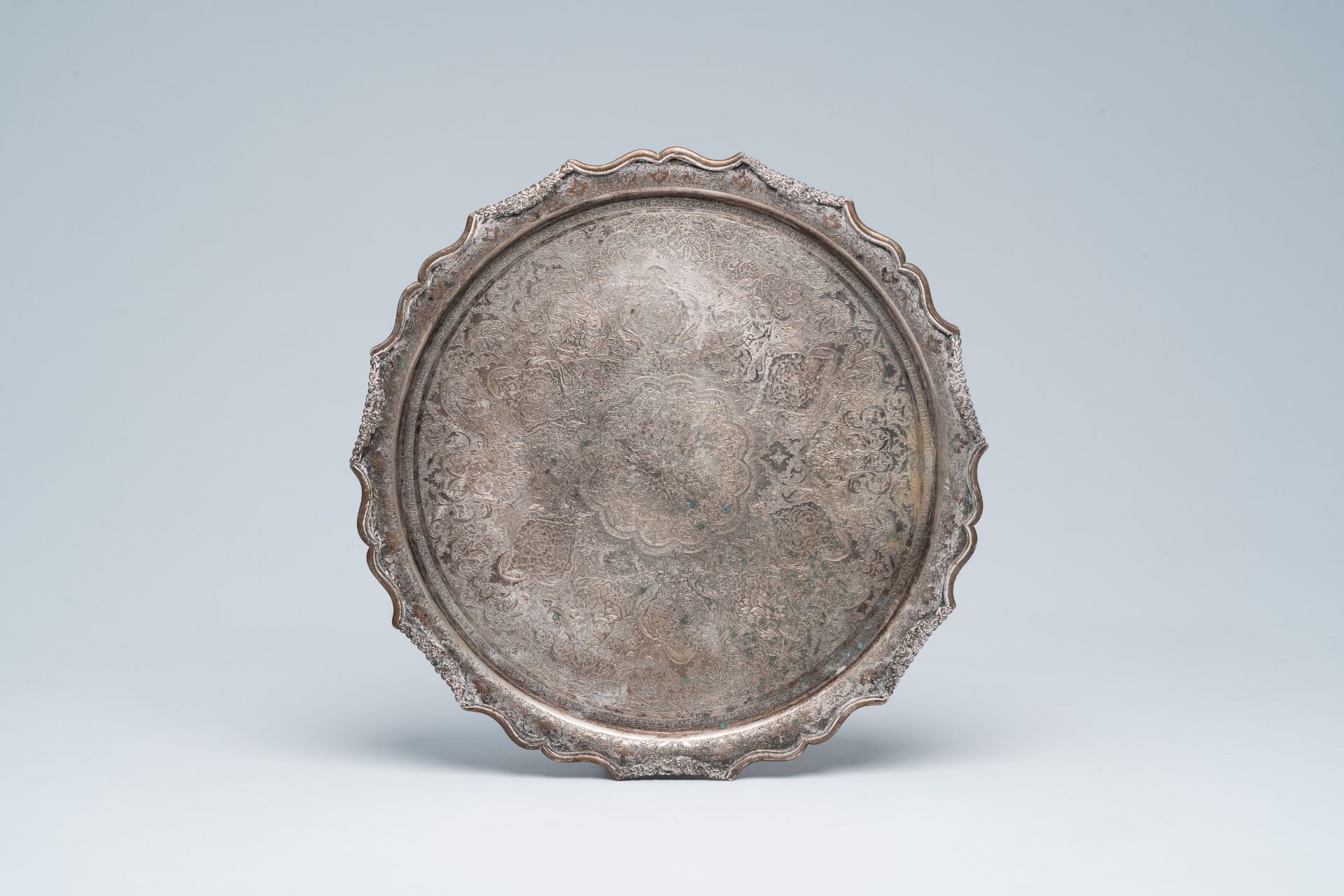 A Persian silver plate with elaborate floral design, 19th/20th C.