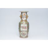 A large Chinese Canton famille rose vase with immortals and their pupils and butterflies and birds a