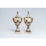 A pair of Neoclassical marble cassolettes mounted with rams' heads and floral garlands, 19th/20th C.