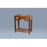 A Chinese wood side table with three drawers, 19th/20th C.